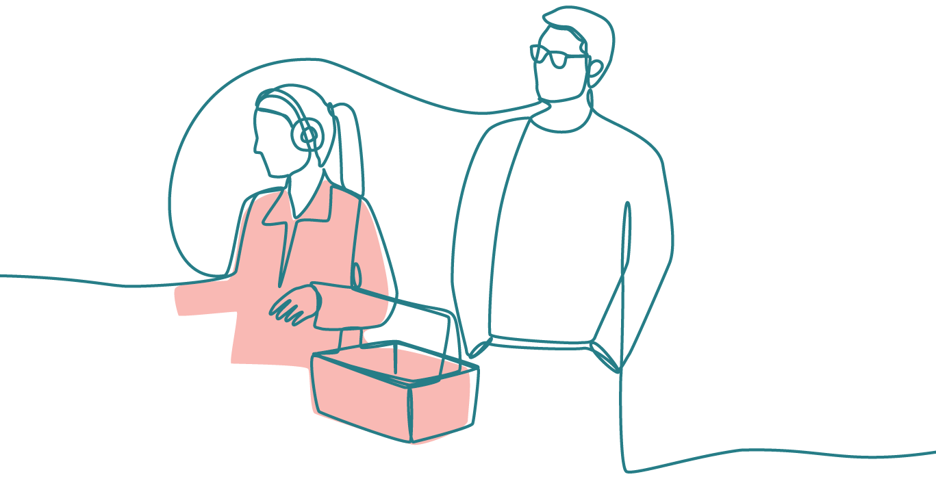 Two people standing next to each other. One is wearing headphones and carrying a shopping basket