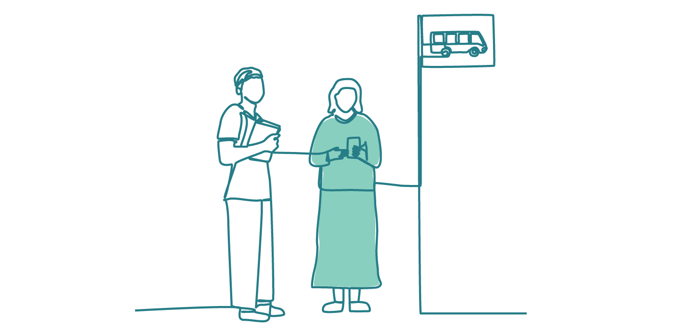 Two people standing at a bus stop