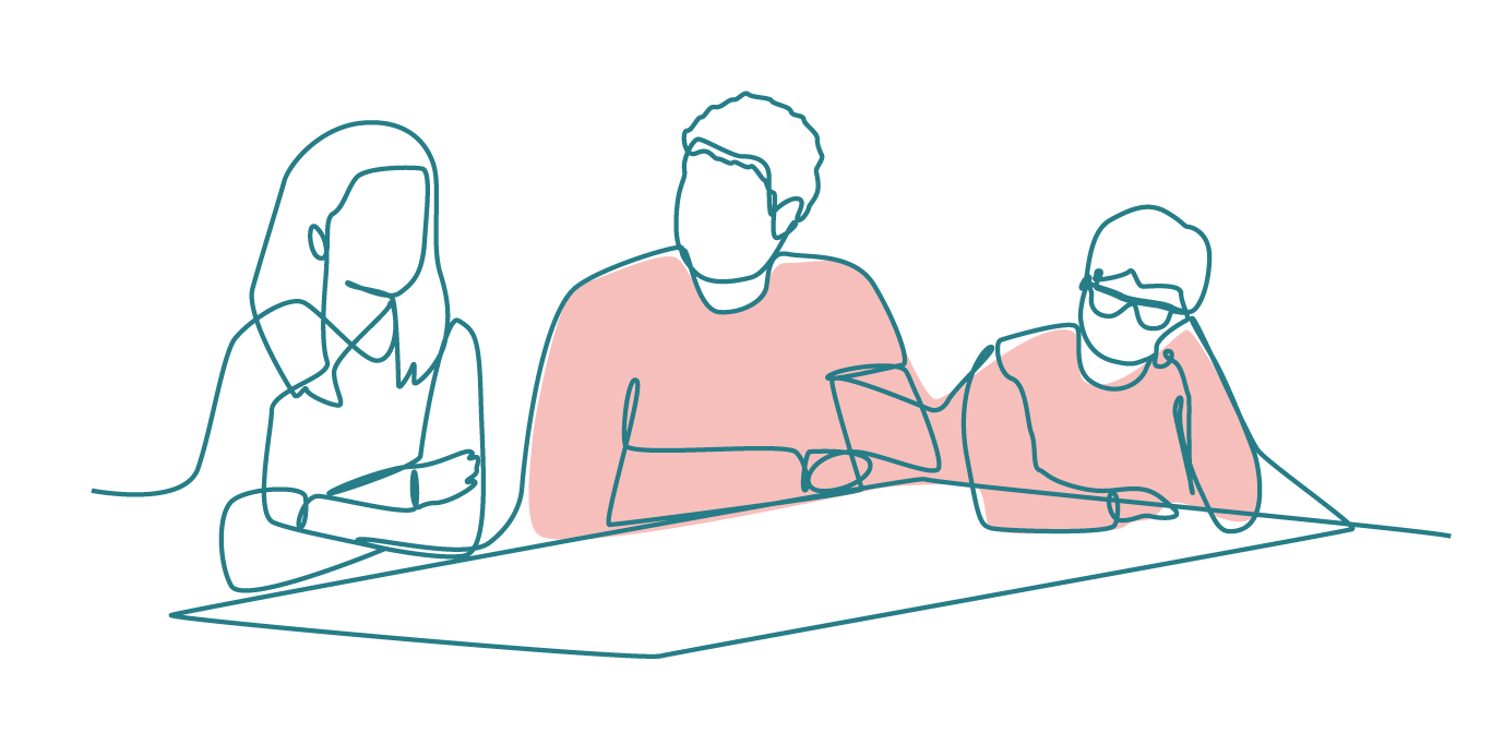 Two adults and a child sitting around a table