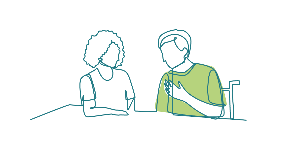 Two people having a conversation at a table