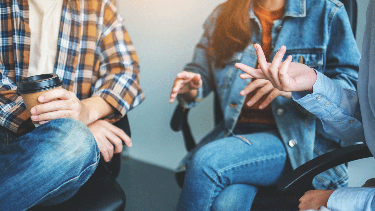 A group of people chat.