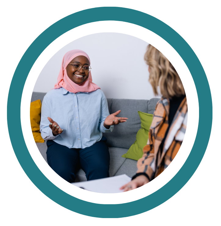Decorative image showing smiling person wearing headscarf and gesticulating with their hands as they talk.